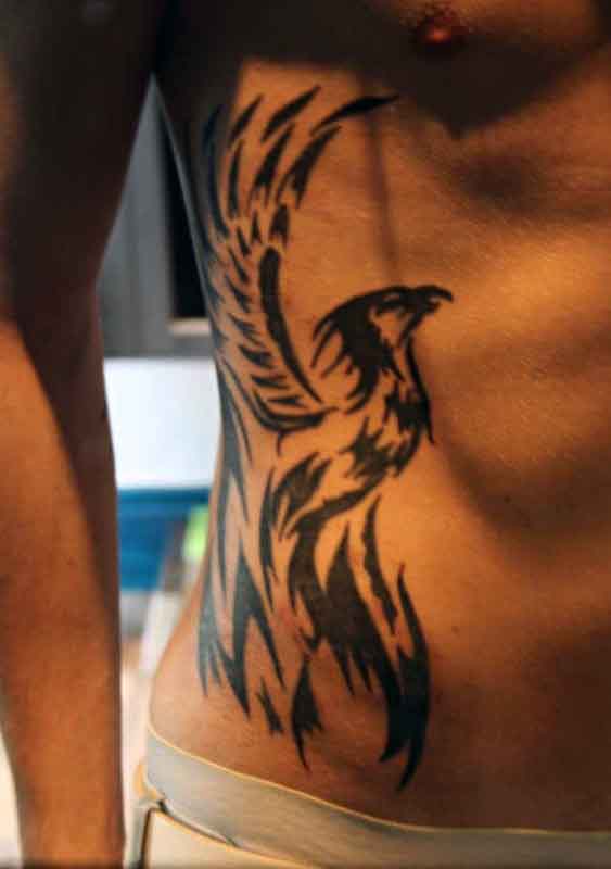 40 Tribal Phoenix Tattoo-Designs für Männer - Mythologie Tinte Ideen  